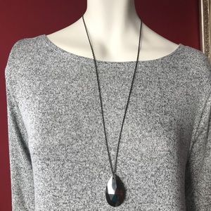 Necklace with pendant.
